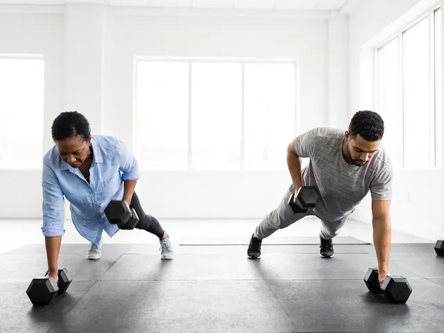 Two people training together at the gym
